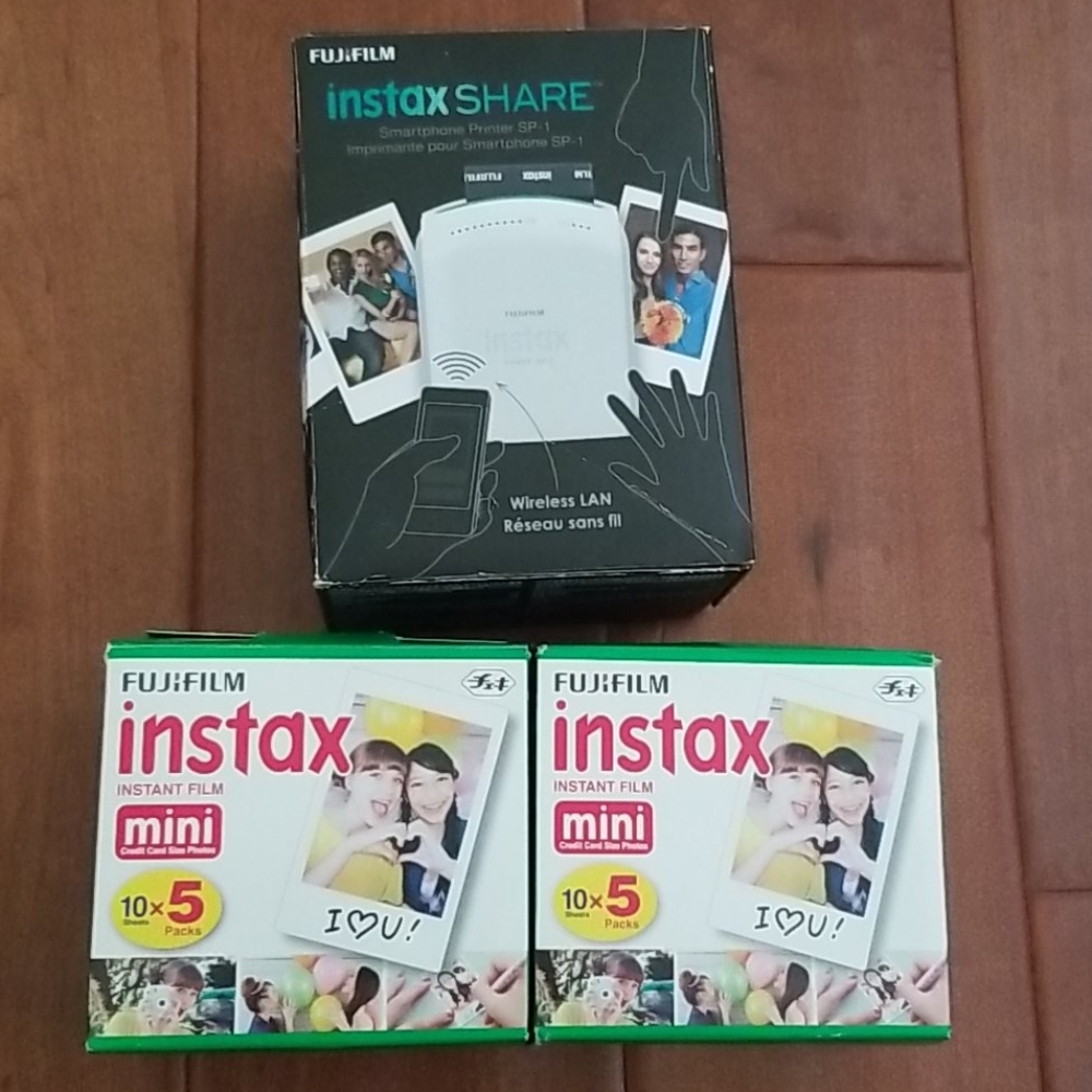 Smartphone printer and 2 boxes of instant film.